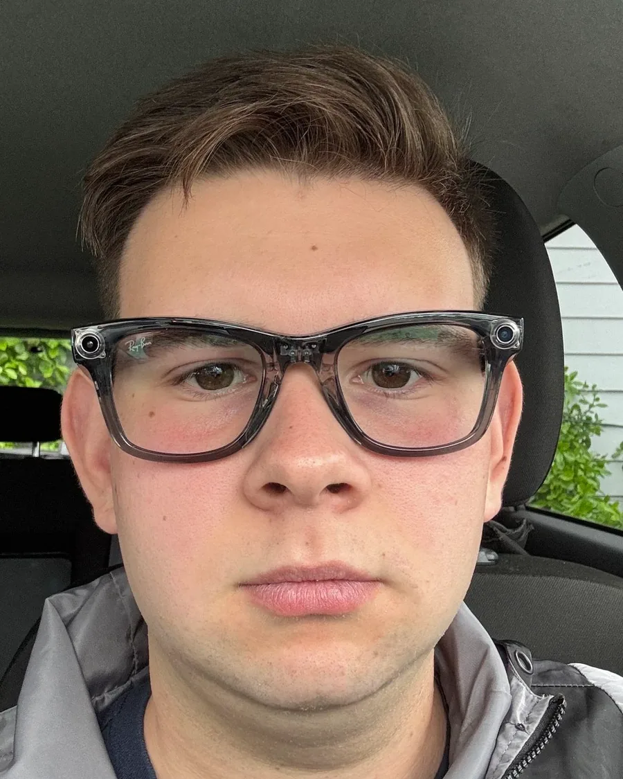 Peter Arapas wearing glasses and a grey jacket